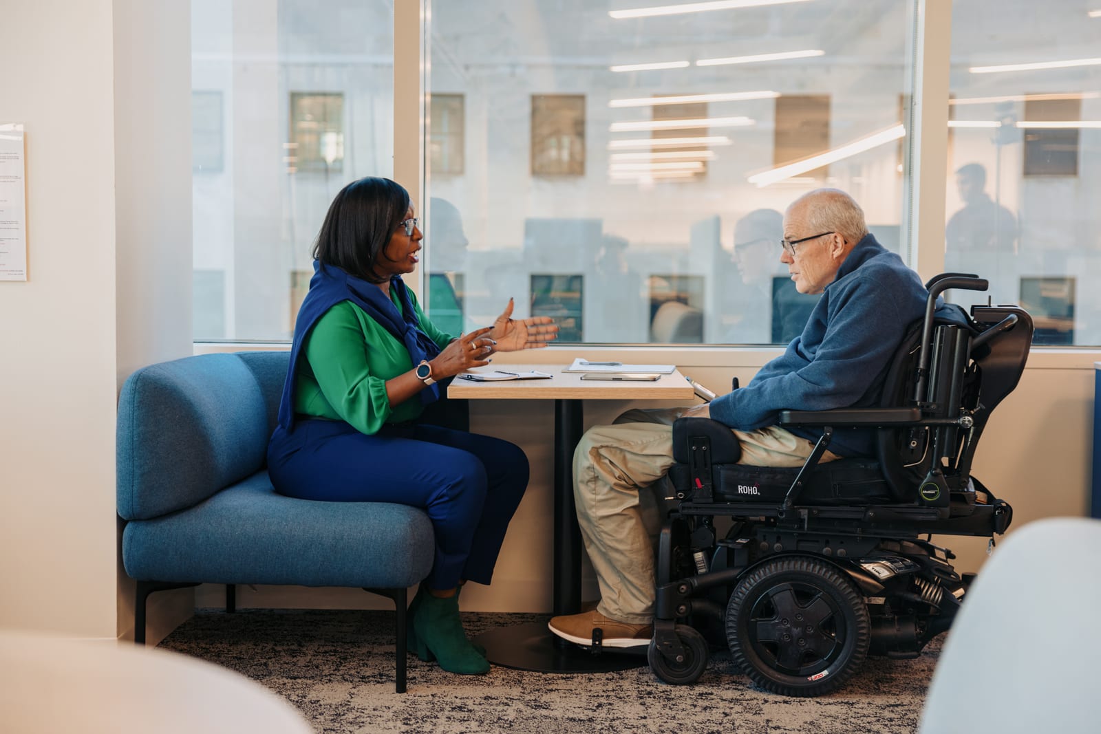 Two colleagues reviewing accessible documents together